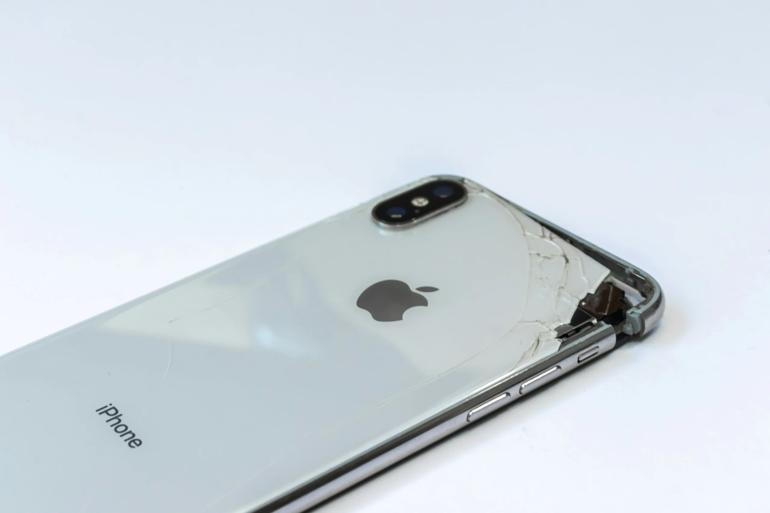 A silver iPhone on a desk