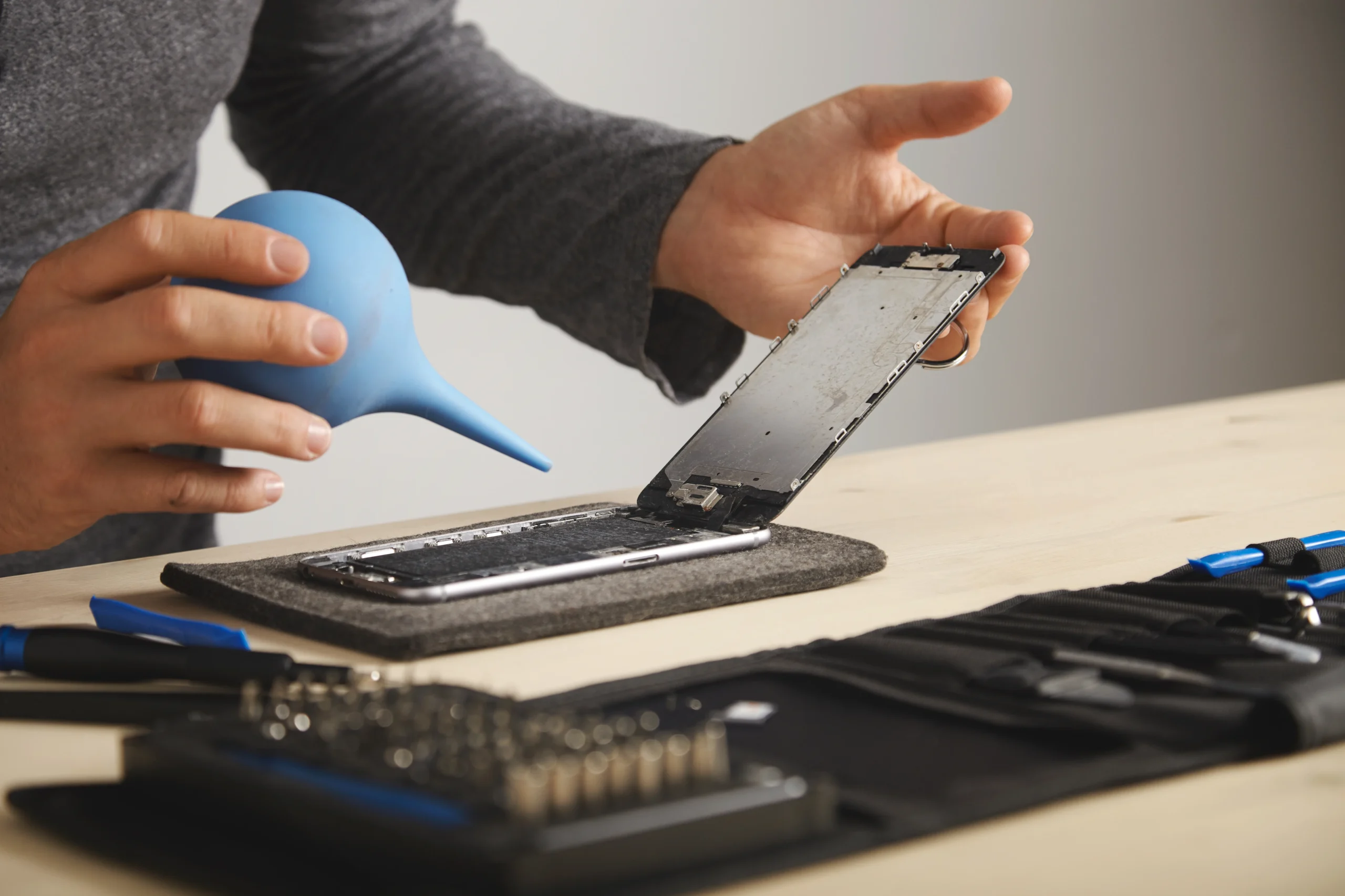 A silver iPhone on a desk